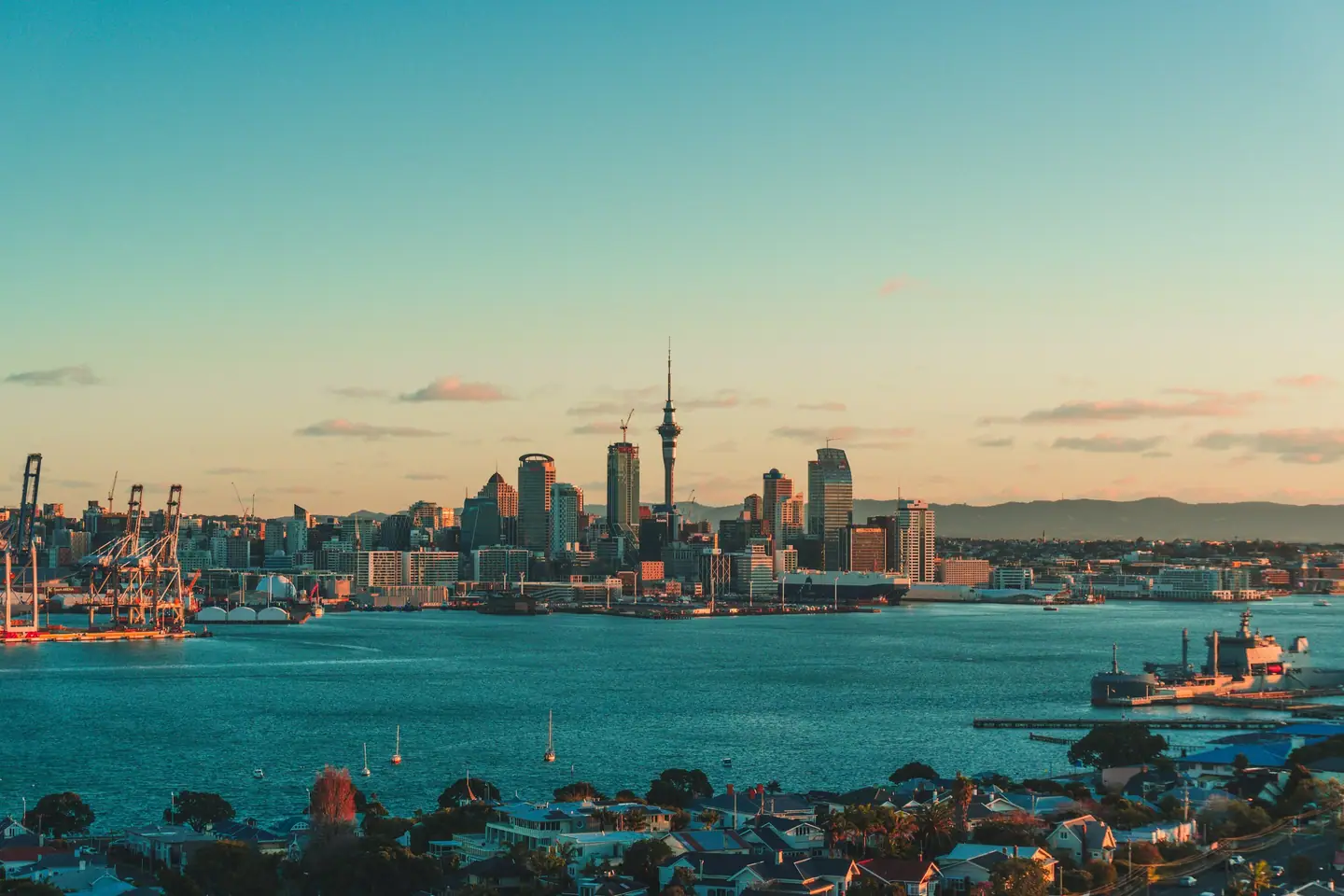 Auckland skyline and Waitematā Harbour in the evening light.